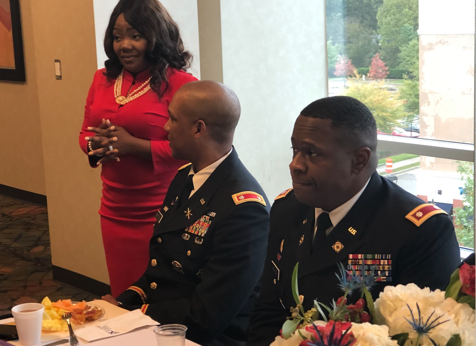 Dr. LaToya Reed, director of JSU’s Veteran and Military Student Support, consults with Brookins as the observance prepares to begin with keynote speaker Jackson, right. (Photo by L.A. Warren/JSU)