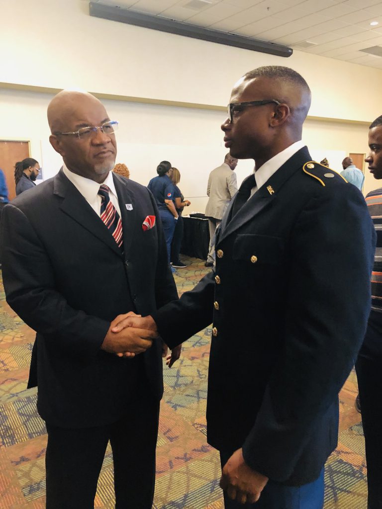 JSU President William B. Bynum Jr. greets Christopher Hines, a JSU graduate cadet studying criminology. Hines aims to give back to the community and the U.S. through 25 years of service and ultimately as a general. (Photo by L.A. Warren/JSU)