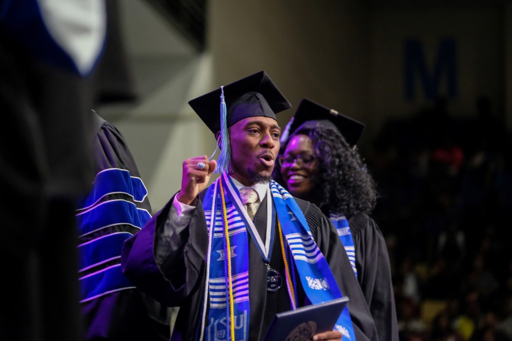 Graduates were elated to receive their diploma on Friday, Dec. 7. (Charles A. Smith/University Communications)