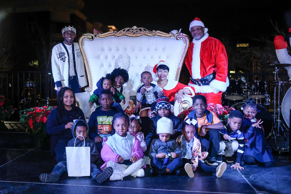 Santa Claus (JSU President William B. Bynum Jr.), Mrs. Claus (Deborah Bynum), Mister JSU Darrian Johnson and Miss JSU Gabrielle Baker spread holiday cheer with community children. (Photo by Charles A. Smith/JSU)