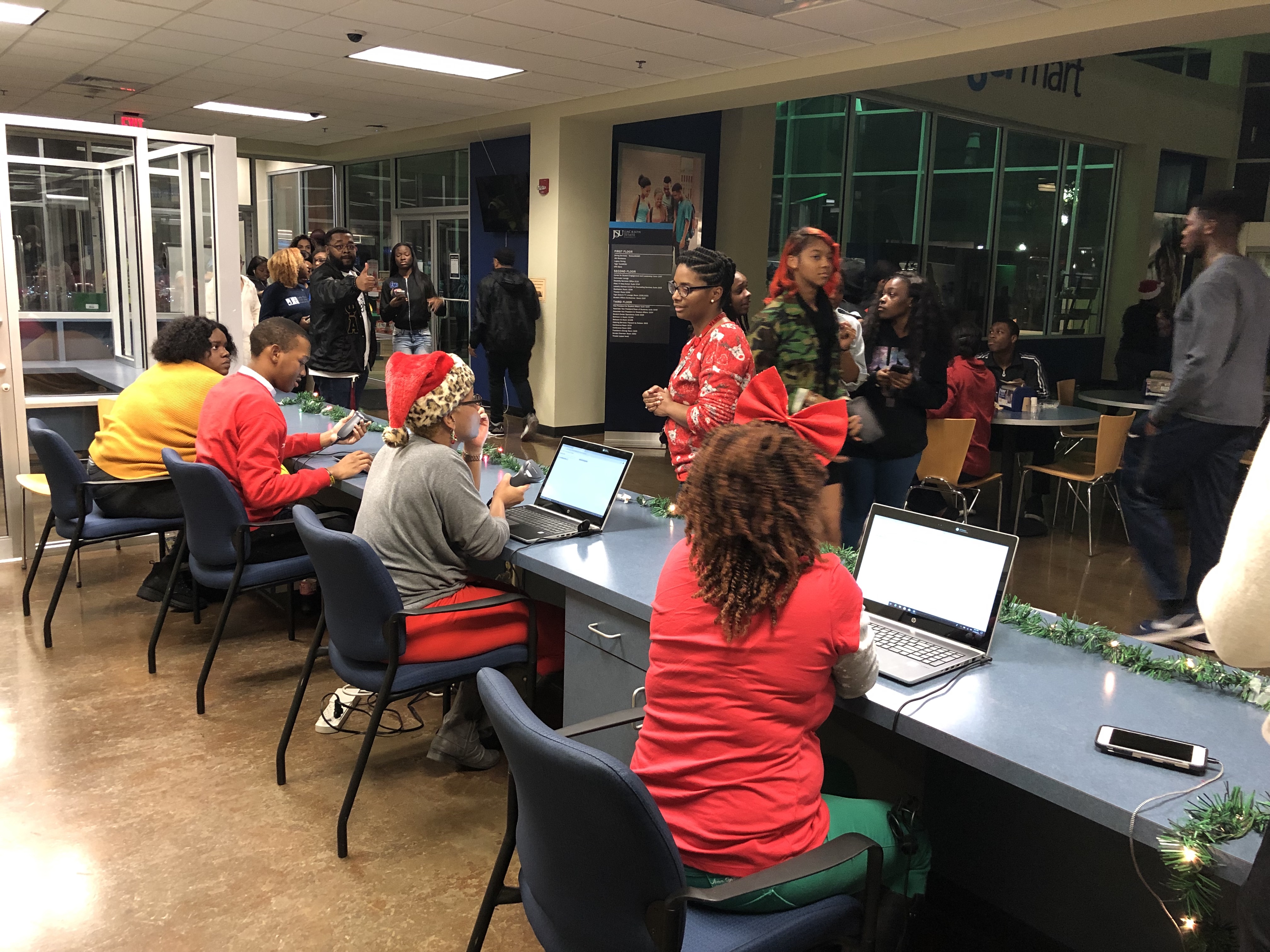 MIDNITEB2: Volunteers prepare to check in students for the annual gathering inside the Student Center. (Photo by L.A. Warren)