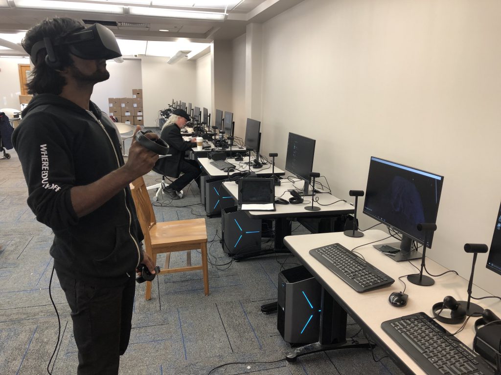 Anthony Gomes, a JSU graduate student in computer science from Bangladesh, is experimenting with various applications. He will train to become a VR curator and teach others. (Photo by L.A. Warren/JSU)