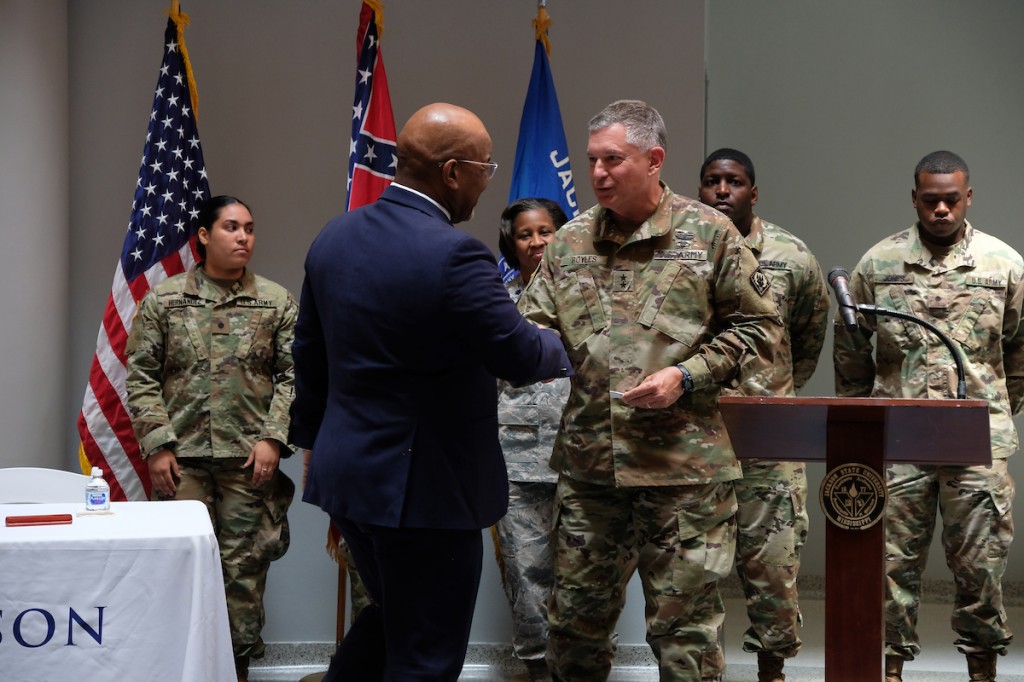 Bynum and Boyles seal the deal with a handshake and agree that quality education will improve the readiness and leadership of the men and women serving in the Mississippi National Guard. (Photo by Charles A. Smith/JSU)