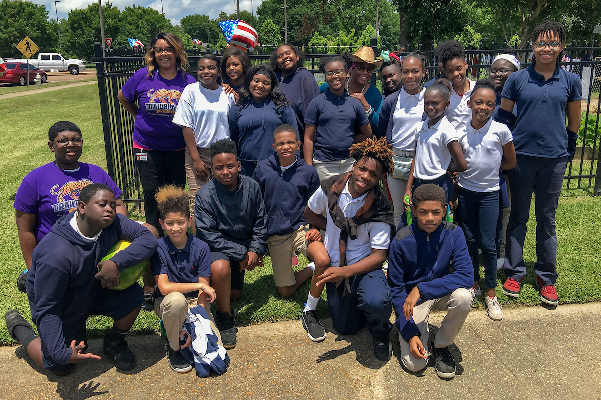 Teen students celebrate their success. The garden produce that they harvested sold rather quickly. However, they’ll have another opportunity in August or September for their second Farmers Market. (Photo by Charles A. Smith/JSU)