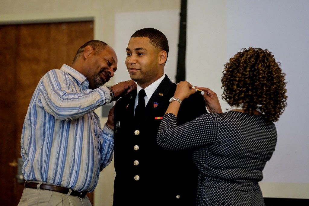 James A. Jefferson, a graphic design major, who graduated on May 4, is pinned by his parents during the commissioning ceremony. (Photo by Charles A. Smith/JSU)