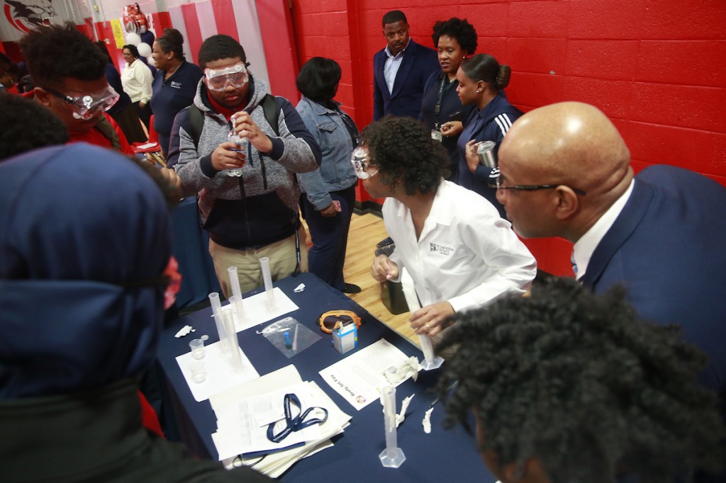 Bynum observes as a North Panola student participates in an experiment. (Photo by Charles A. Smith/JSU)