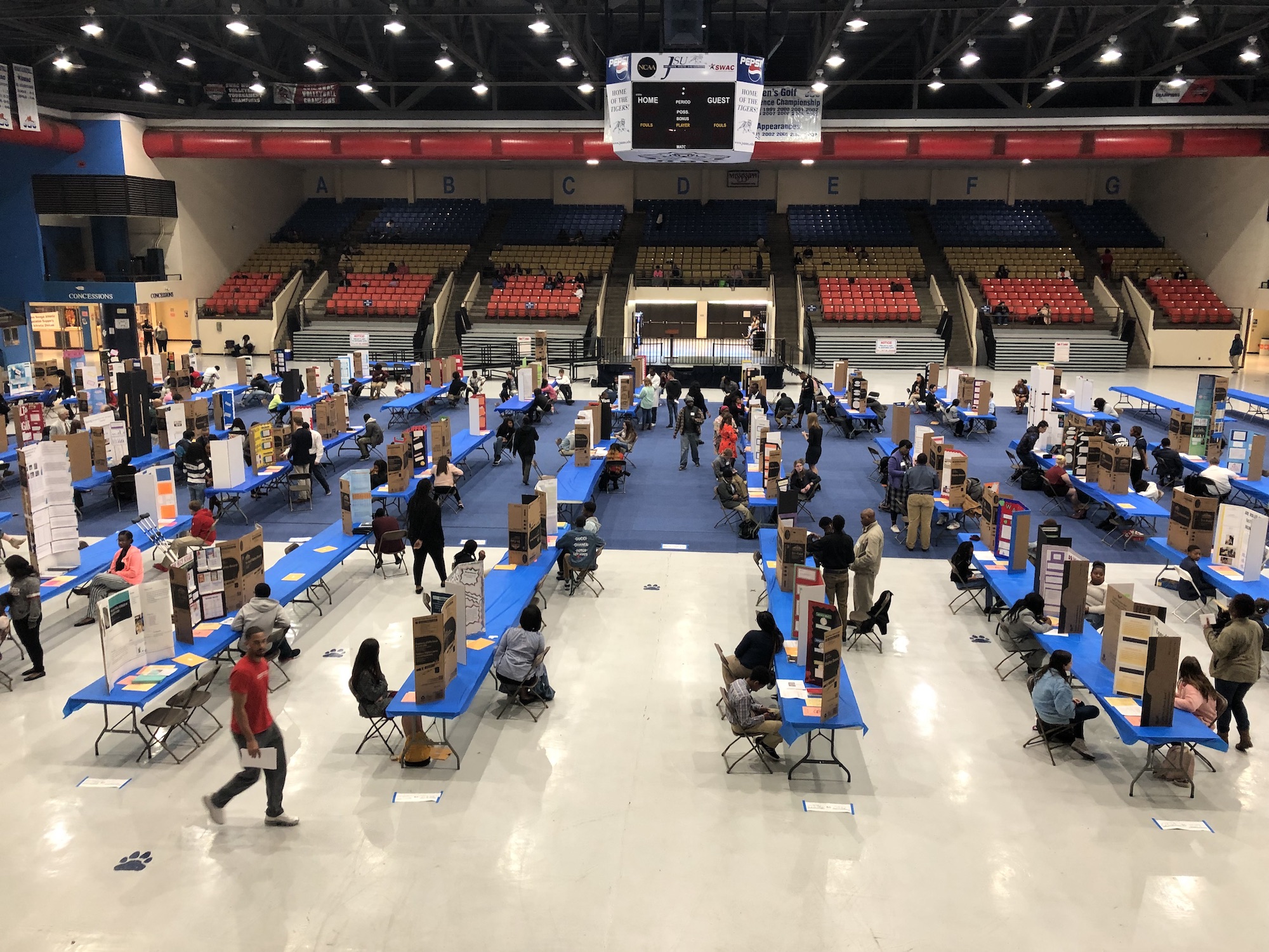 Students watch and wait as judges mill around checking each science display. (Photo by L.A. Warren/JSU)