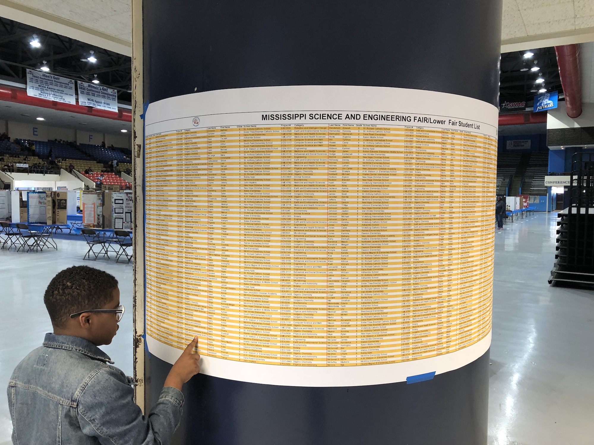 A student checks names of participants at the Region II Mississippi Science and Engineering Fair this spring. Participants represent six counties: Claiborne, Copiah, Hinds, Madison, Rankin and Warren. (Photo by L.A. Warren/JSU)