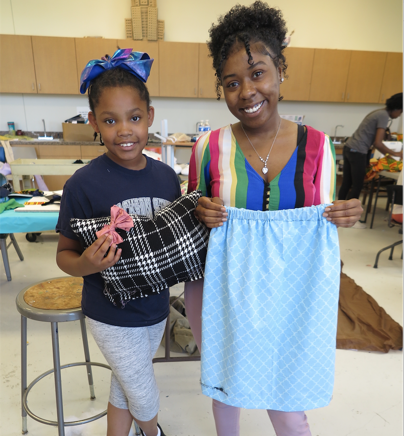 Heiress Frazier (left) is a fourth grader at Green Elementary. "I like all the people at the camp. I also really love that we’re making dresses, pillows and bows," said Frazier, pictured with Jayah Alexander, an instructor for the camp. (Photo by Rachel James-Terry/JSU)