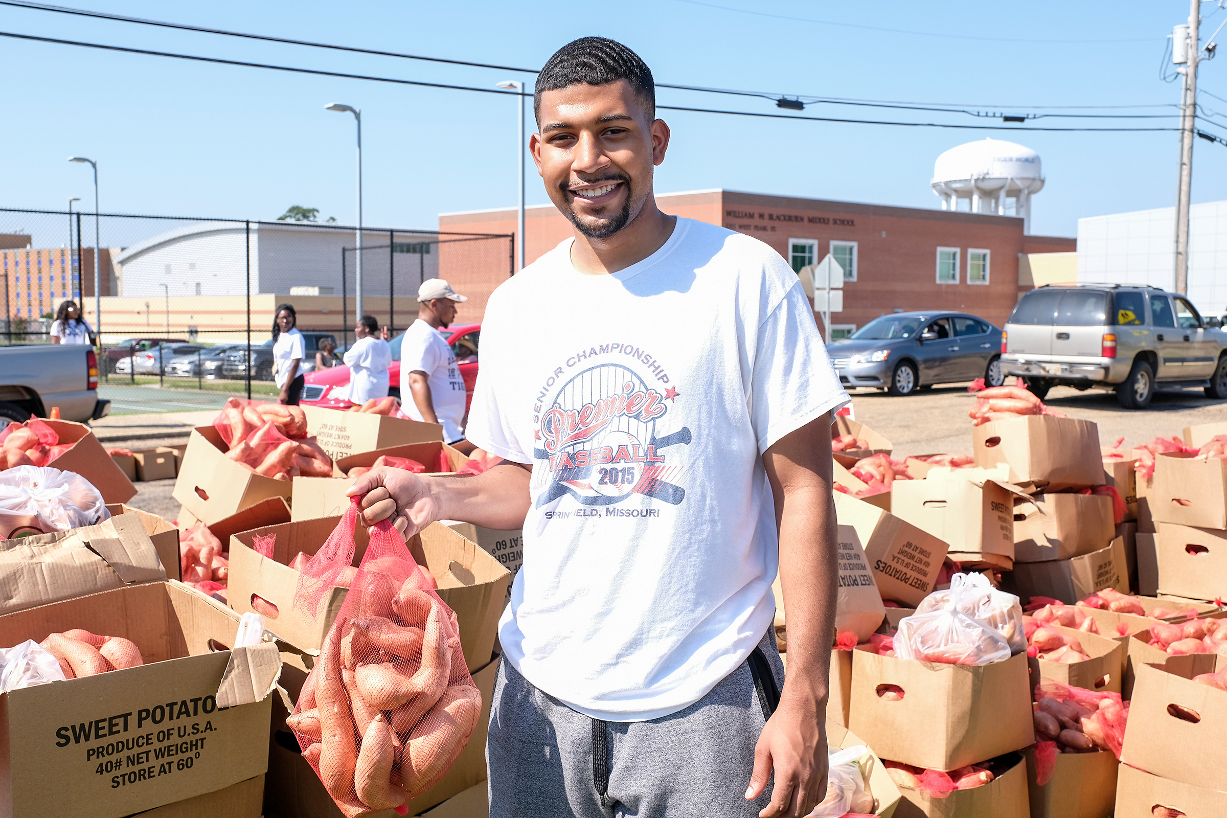 The Crop Drop, an annual event hosted by Jackson State University and the Society of St. Andrews, donated 25, 000 pounds of sweet potatoes and other goods to the community on Saturday. Grant Broadway, a senior, and Mister JSU, 2019-2020, said that Jackson State University sets the precedent for students when it comes to service. (Photo by Charles A. Smith/JSU)