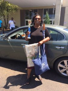 Delcina McGlothin displays her winnings from capturing first place in the sweet potatoe pie contest, a new feature of this year's Crop Drop. Deldarige Wolf took home second place with Marcia Reed sliding into the third place spot. (Photo special to JSU)