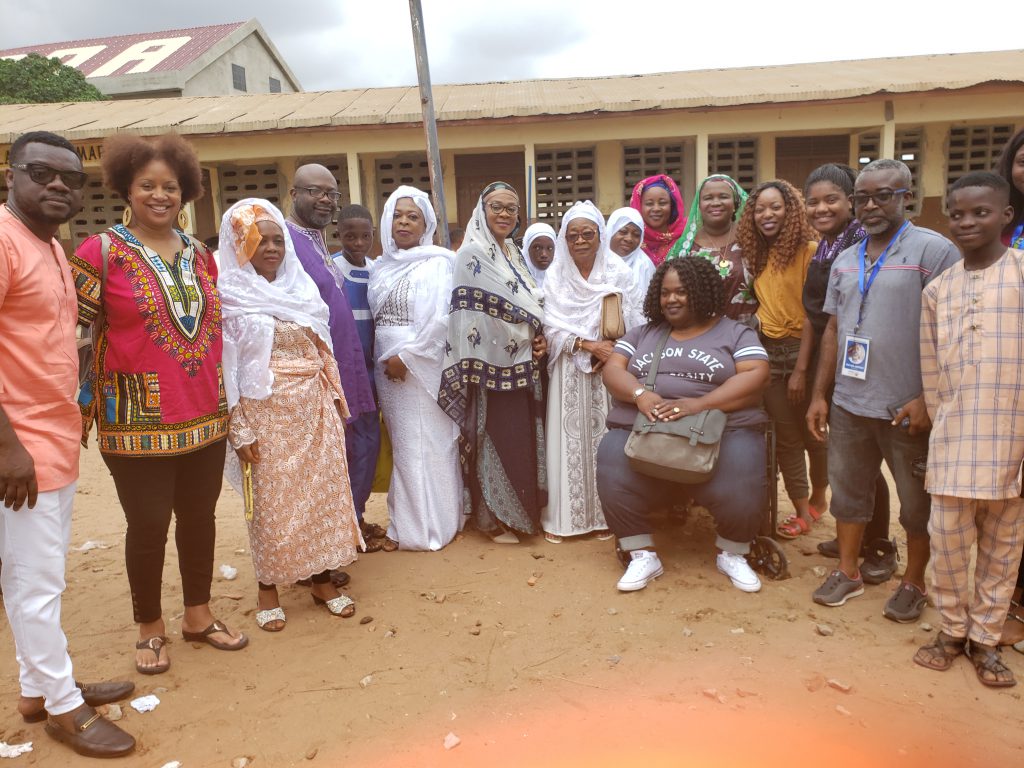 While in Ghana, West Africa, JSU students pose for a picture with their host, Nafis Quaye, and his family. (Photo special to JSU)