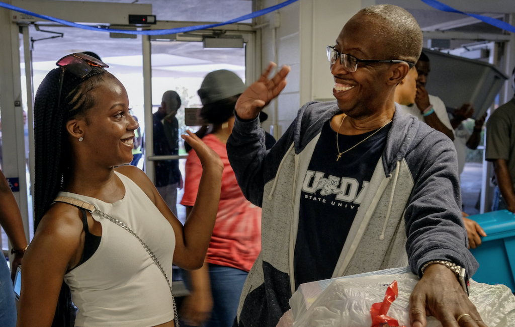 Incoming freshman Mia Jutan is pictured high- fiving her father, John Jutan. The Jamaica native says, "When Mia decided to attend Jackson State, we knew that was the best decision for her. She's so excited to be here and we will support her throughout her tenure."(Photo by Charles A. Smith/JSU)