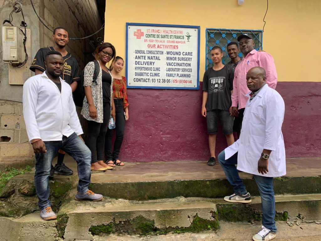 Markus Brooks, a senior criminal justice major, poses with members of the St. Francis Medical Center staff where he worked during his study-abroad experience in Cameroon. (Photo special to JSU)