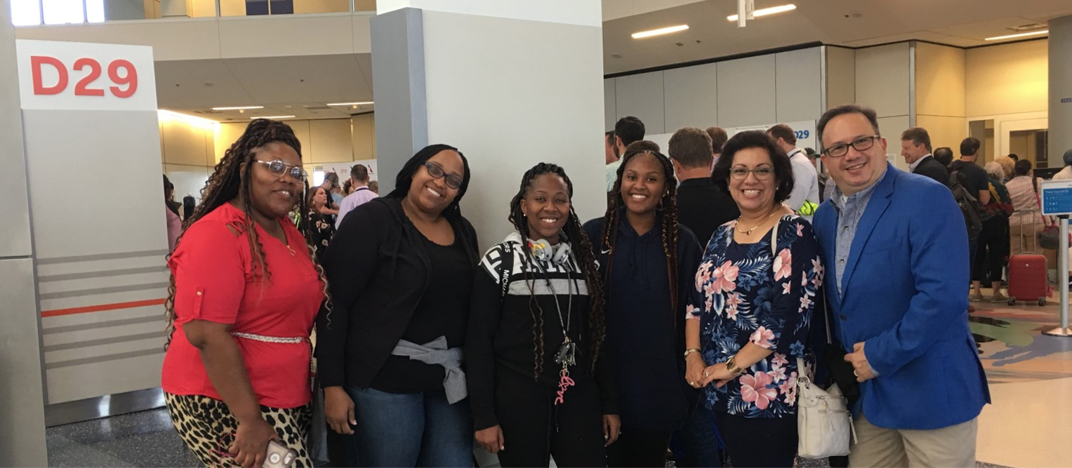A JSU team from the School of Public Health prepares for departure to Spain in the Dallas Fort-Worth International Airport led by Dr. Nelson Atehortua, assistant professor in the Department of Behavioral and Environmental Health in JSU’s School of Public. Graduate students are Jessica James, left, Catrina Brazzle, Torri Walton-Franklin, Christal Lewis and Stella Patino.