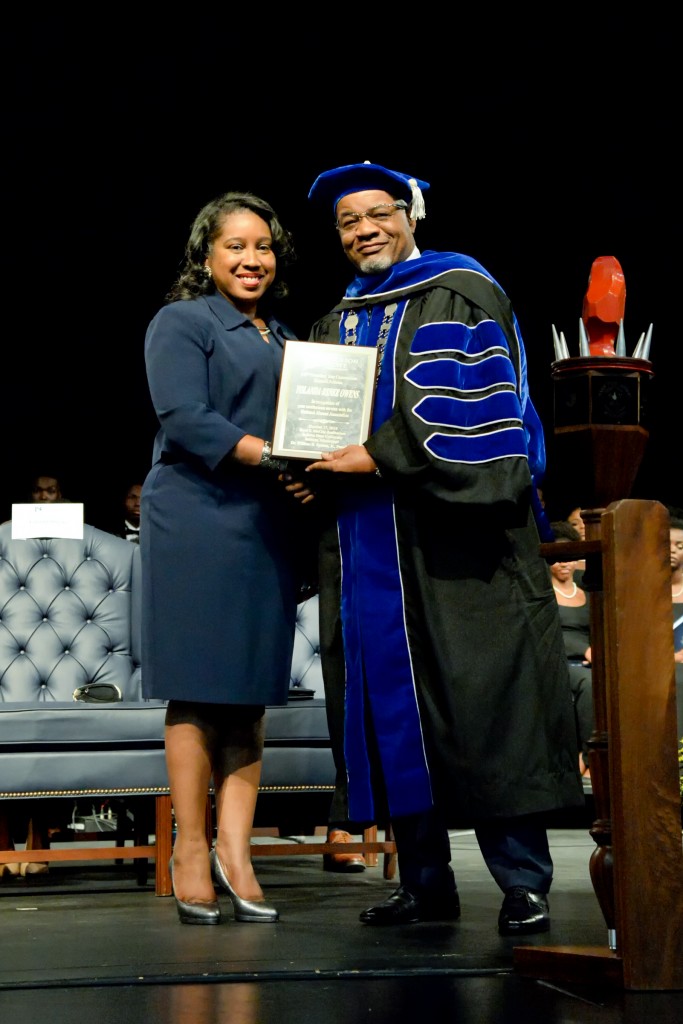 After the Founders' Day keynote address by Yolanda Owens, Dr. William B. Bynum Jr., JSU president honors her with a plaque for her service as JSUNAA president and for establishing the Yolanda R. Owens Endowed Scholarship to support junior and senior STEM majors. Owens has worked as a civil engineer and is now senior contract administrator for Kinder Morgan. (Photo by Darek Ashley)