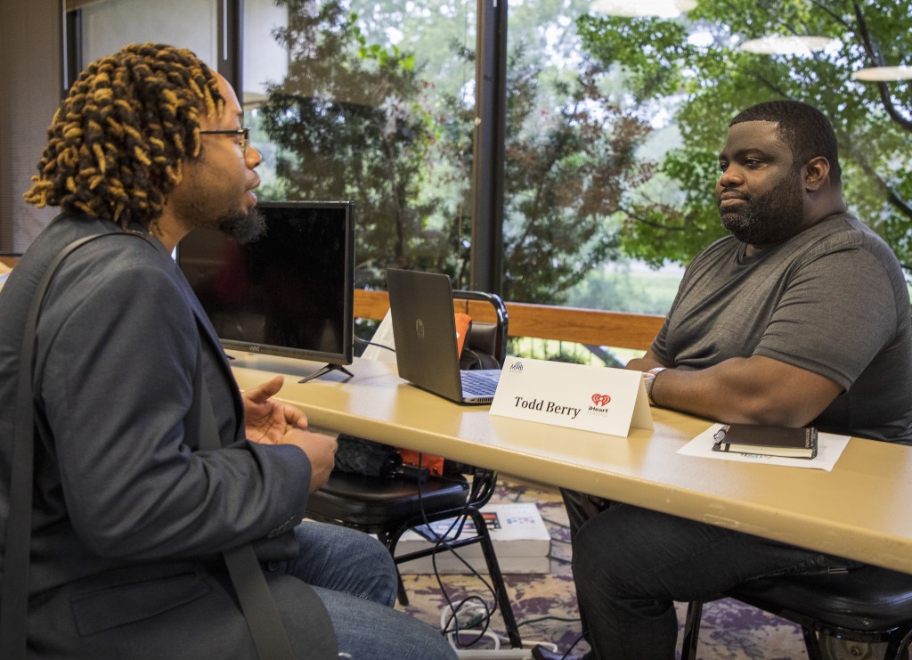 Mario Nichols, a junior integrated marketing communications student in Journalism and Media Studies, gets career tips from Terrez Harris with iHeart Media. (Photos by Donn Spann)