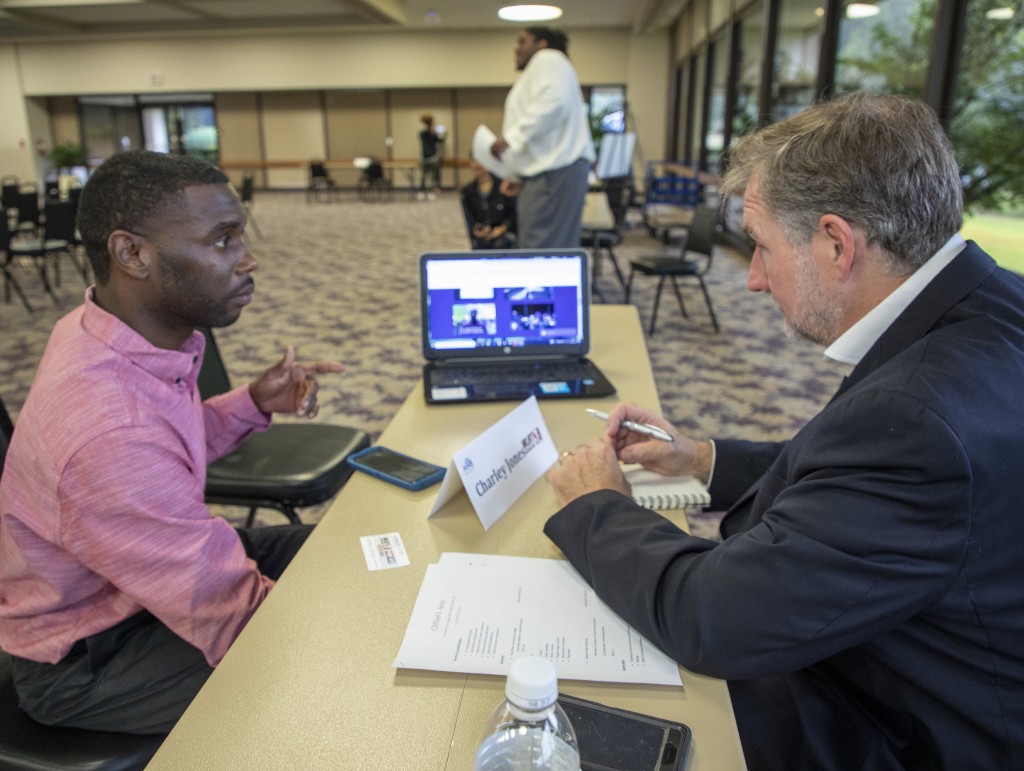 Leonard Moore, a senior multimedia journalism student in Journalism and Media Studies interviews with Charley Jones, assistant news director at WLBT. (Photo by Don Spann)