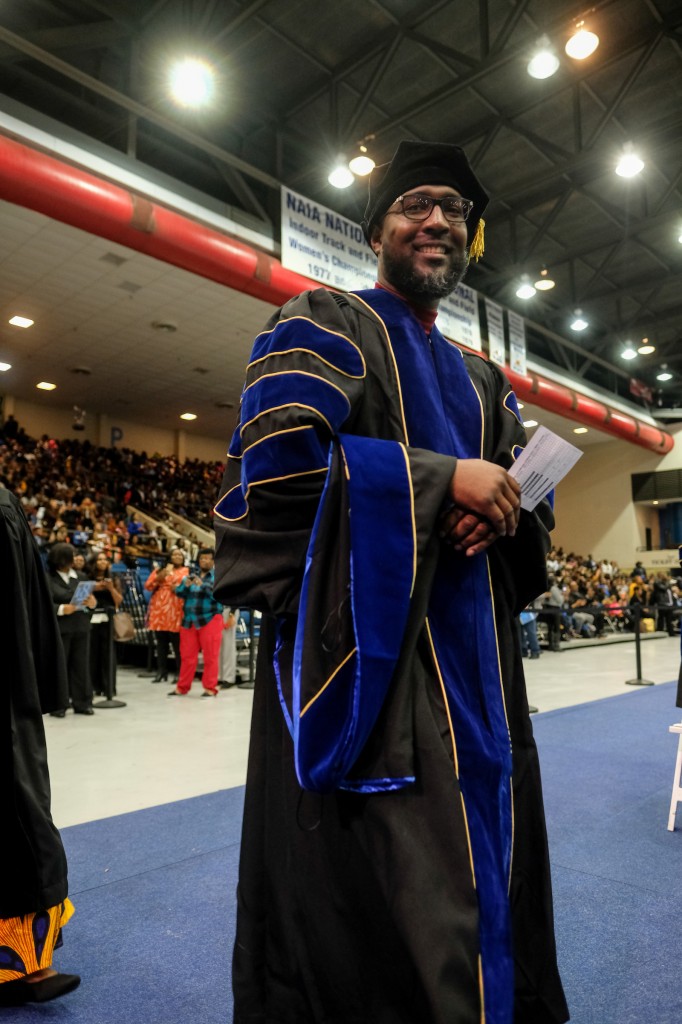Arron Richardson, an employee at JSU, poses with his wife after commencement exercises where he received his Ph.D. Pondering what's next, Richardson said, "I learned at an early age that I’m the CEO of Arron Richardson and I must make decisions that not only impact my life, but generations after me. I love the position I’m currently in now at the institution. I love working with students daily helping them to realize their passion and maximizing their strengths." (Photo special to JSU)