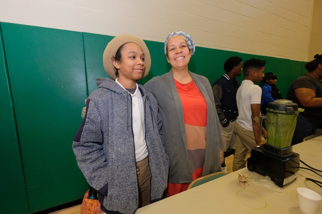 "We are a really healthy family and we are also vegan. We wanted to make something healthy and quick so this 'New You' smoothie was our strategy. It is green and delicious. There is no salt or sugar in our recipe," says Nia Selassie. Nia and her son Moe won 1st place. (photo by Charles Smith/University Communications).