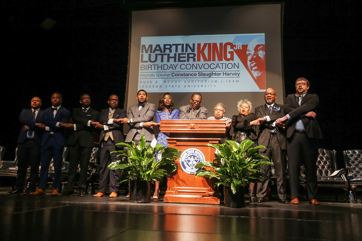 Speakers join in the singing of “We Shall Overcome.” (Photo by Charles A. Smith/JSU)