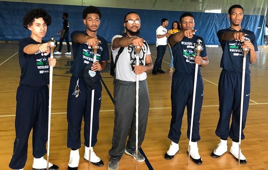Meda poses with the 2020-2021 J5 drum majors consisting of (left to right) Gemal Duncan, Nathanial Kenner, Xavian Mitchell and Gregory Turner. (Photo special to JSU)
