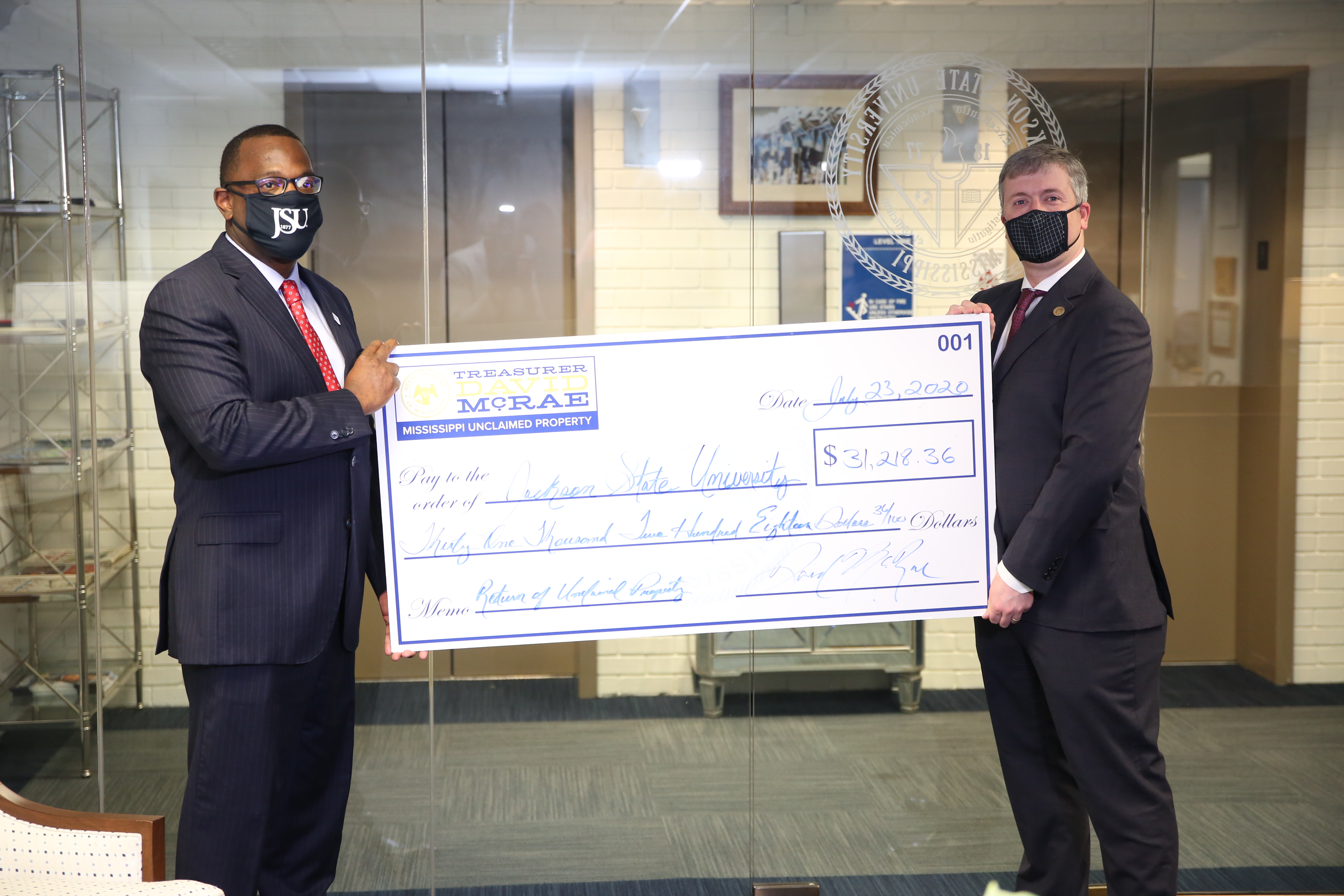 JSU Acting President Thomas K. Hudson is joined by Mississippi State Treasurer David McRae, who visited the campus Friday for a check presentation. Unclaimed money that was returned to the HBCU could further help the institution prepare a safe campus for students’ return in the fall. (Photo by Spencer L. McClenty/JSU)