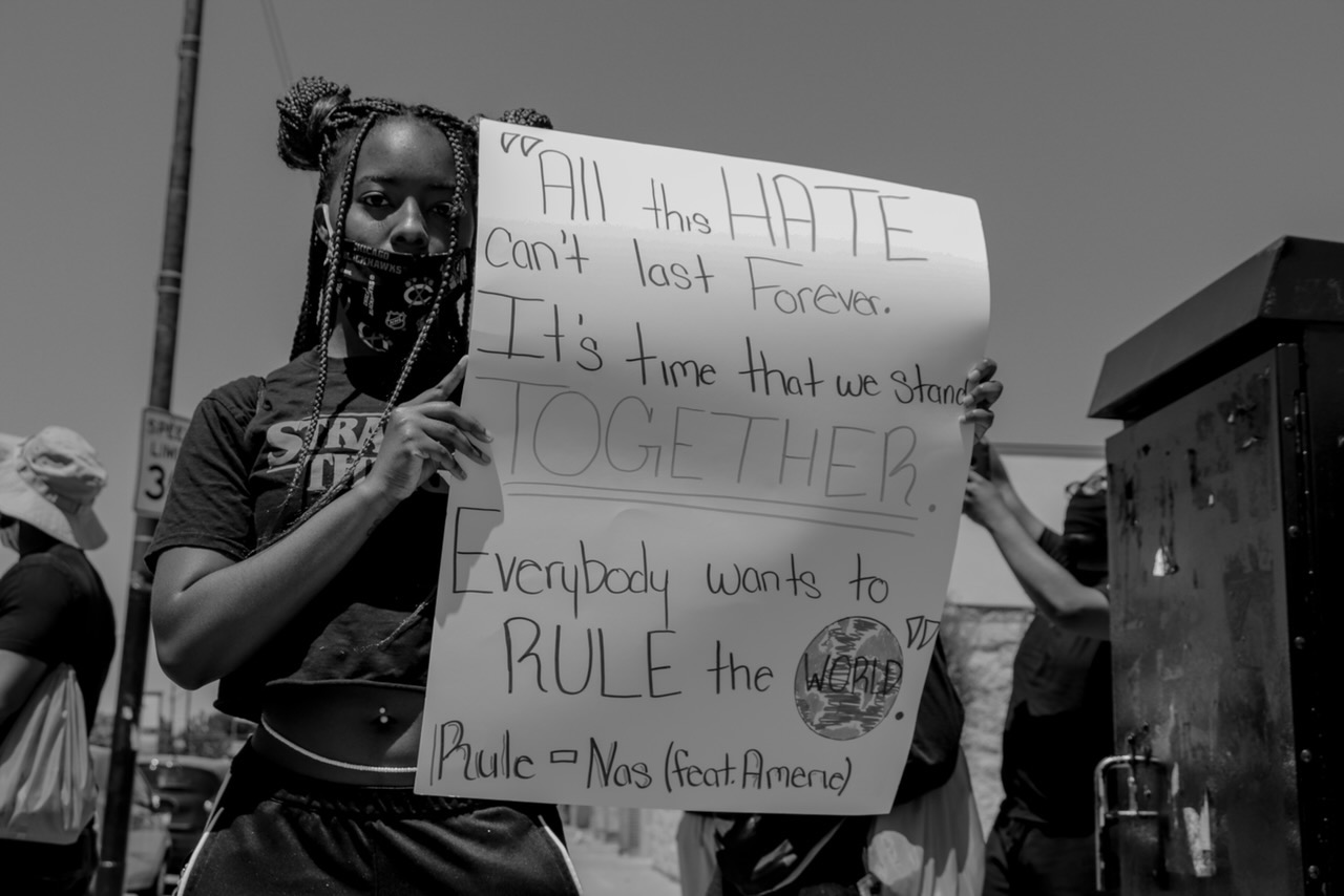 One attendee reminds people that hate cannot last forever. (Photo by Wakil Atig)