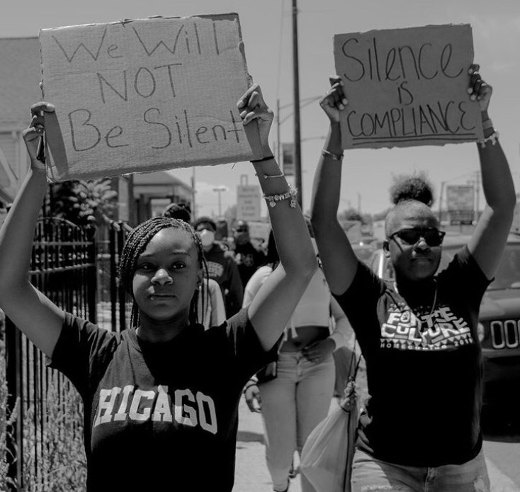Staying silent is not an option for many who took to the streets in the Chicago march mobilized by Michael Taylor, a student at JSU. (Photo by Wakil Atig)
