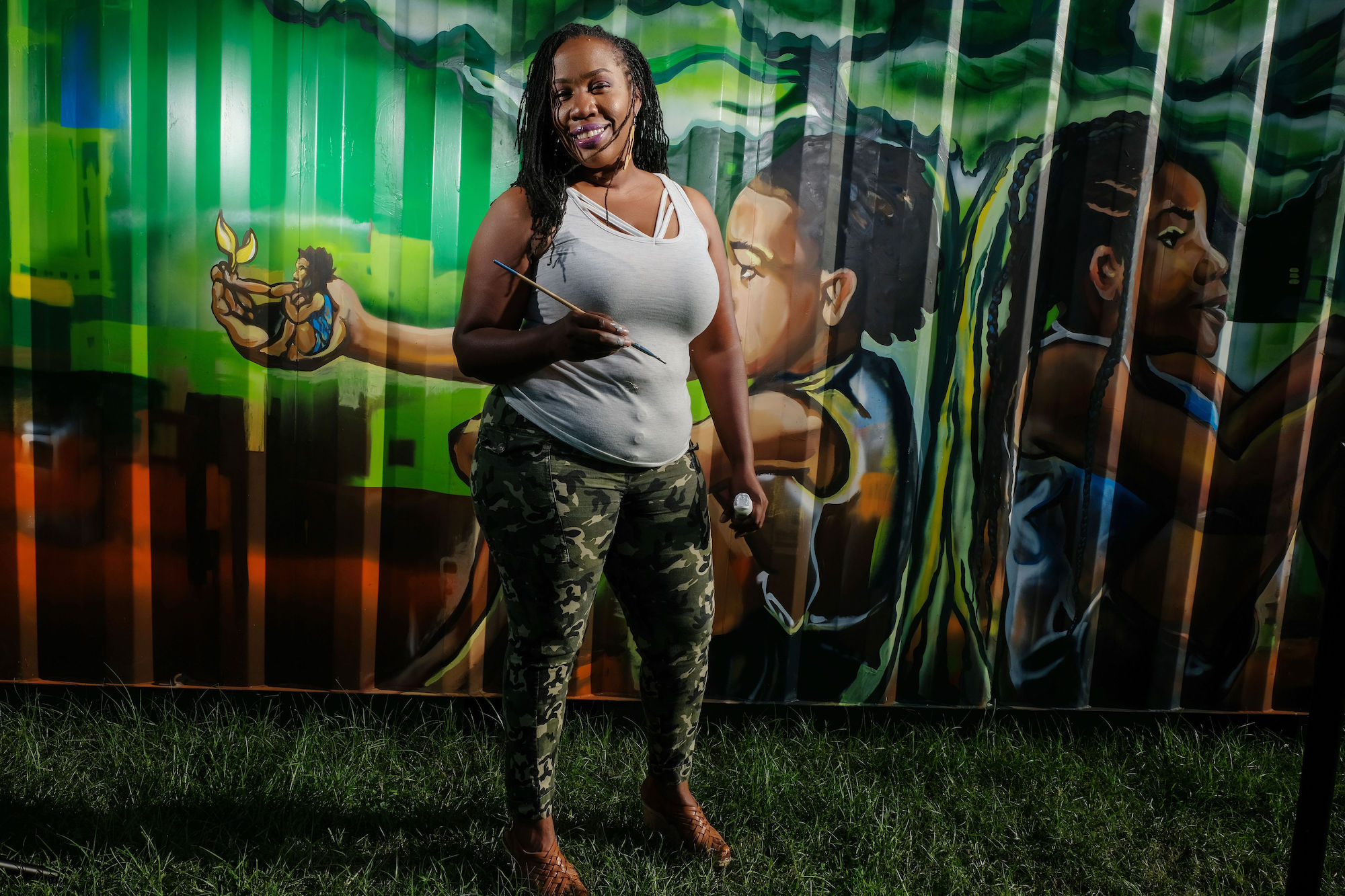 Her mural “Sowing the Seeds of Love” spotlights generational growth. “We can help change the world by what we sow into our children. The knowledge and tools passed down from generation to generation are necessary for sculpting our future,” she said. (Photo by Charles A. Smith/JSU)