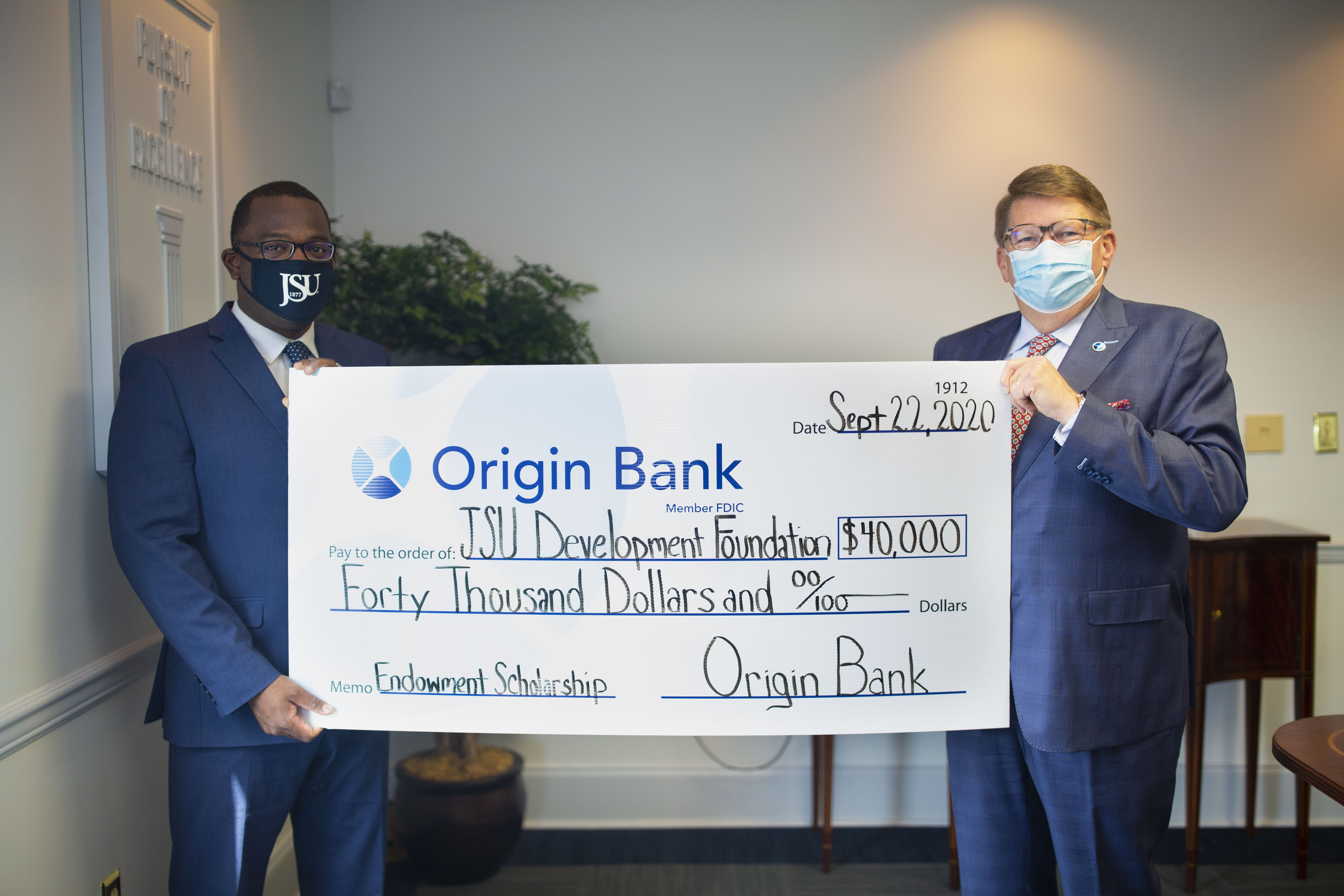 Origin's Bank State President, Larry Ratzlaff presented a check for $40,000 to JSU President Thomas Hudson for student scholarships. (Photo by William Kelly/University Communications)