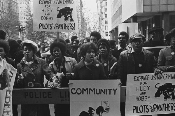 An unidentified man raises his fist in defiance at a protests against the incarceration of members of the Black Panthers, New York, New York, November 17, 1969. The protesters were demanding the release of 21 Black Panther members suspected of plotting various bombing incidents around the city. (Photo by David Fenton/Getty Images)
