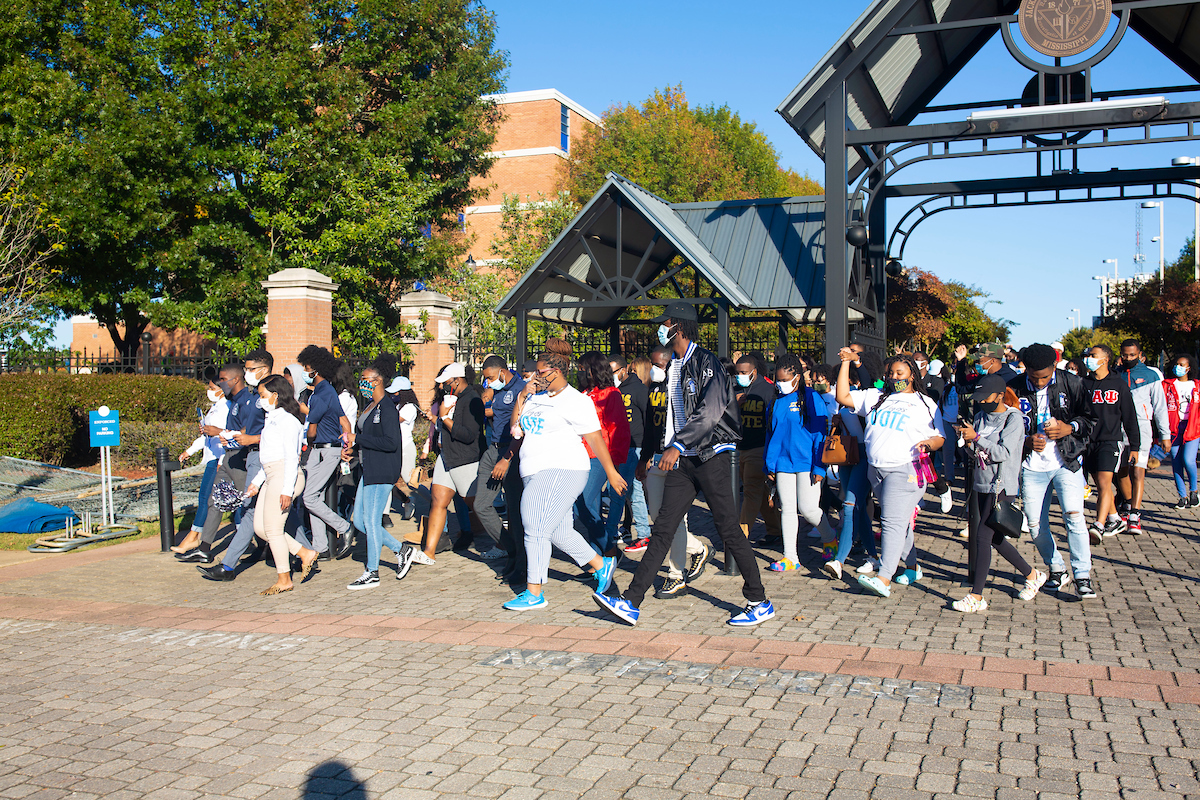 Leaving the Gibbs-Green Memorial Plaza, dozens of JSU students rustle toward the Lee E. Williams Athletics and Assembly Center to cast their votes on Election Day. The march was organized by the Student Government Association. (Photo by William H. Kelly III/University Communications)