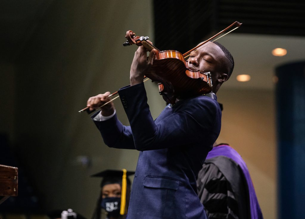 Violinist John Eze Uzodinma II performed “Total Praise” by Richard Smallwood. Other selections were “Jackson Fair” (alma mater) and “God Be With You.” (Photo by Charles A. Smith/JSU)