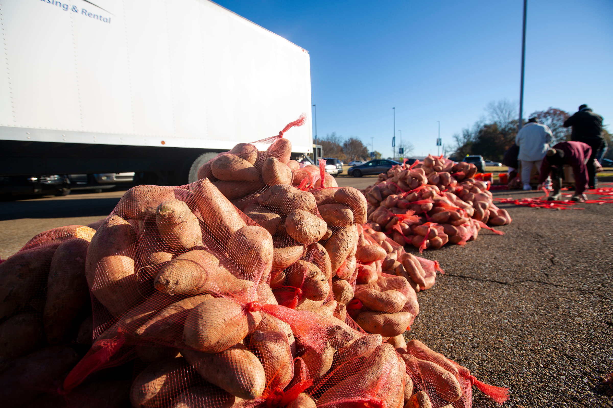 On Dec. 18, residents of West Jackson were treated to 15,000 sweet potatoes and fresh greens during the popular Crop Drop event hosted by JSU's Center for University-Based Development and the Society of St. Andrew. (Photo by William Kelly/JSU)