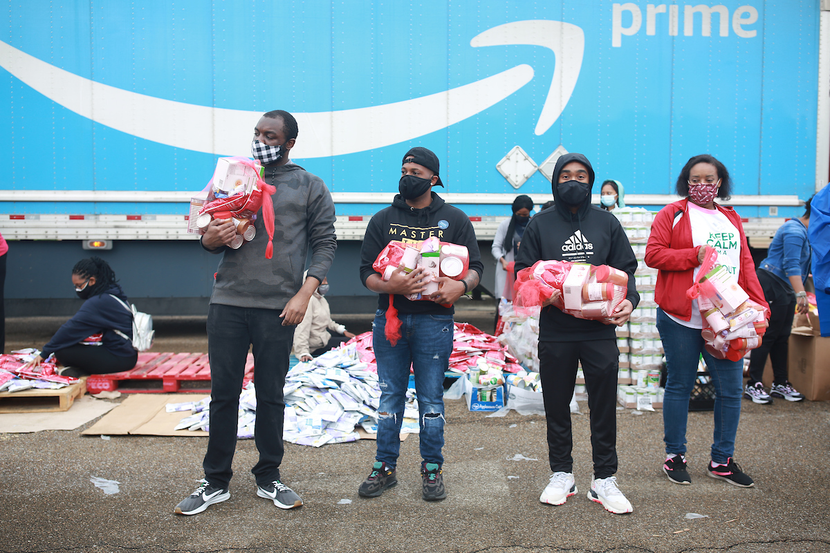 Volunteers prepare to load vehicles with non-perishable goods. Saturday's event was hosted by Jackson State University's Center for Community Engagement. (Photo by William H. Kelly III/JSU)