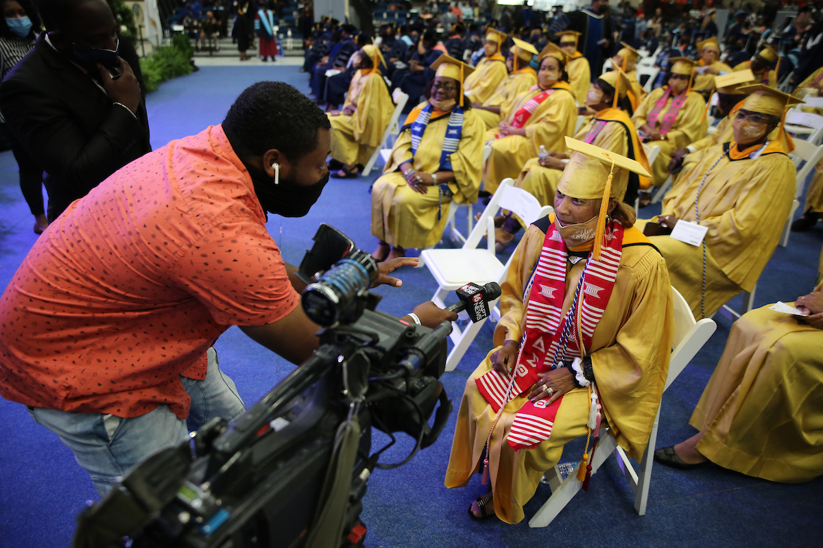 Diane J. Barnes of St. Louis, Missouri, received her golden diploma. She's being interview by her great-nephew, WAPT's Morgan Beard. (Photo by Aron Smith/JSU)