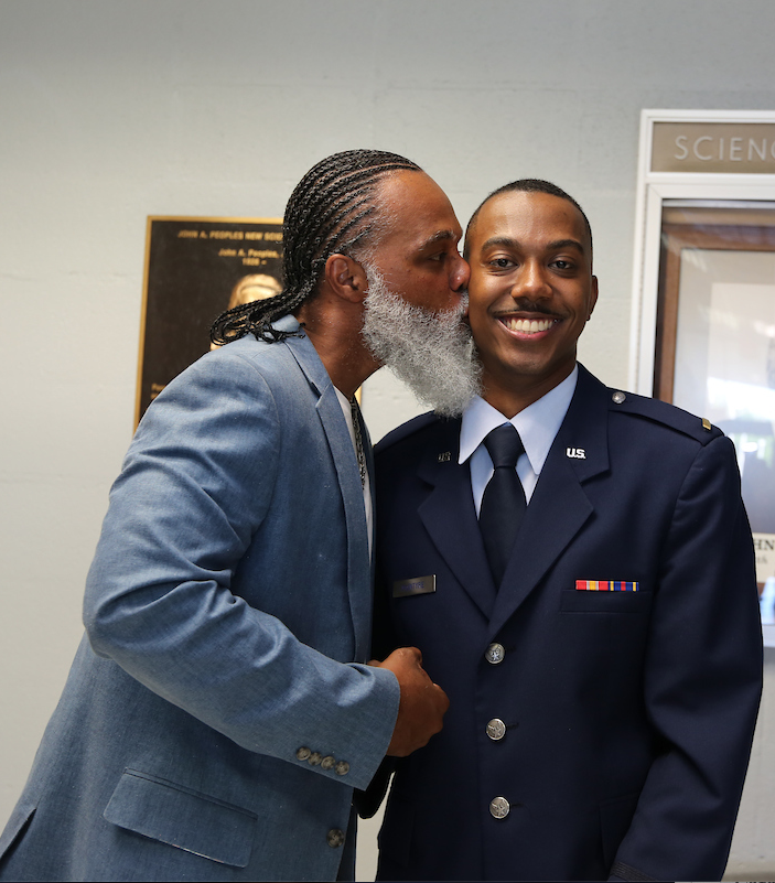 Newly commissioned 2nd Lt. Jalen McIntyre is congratulated by his father. (JSU Photo by Aron Smith/JSU)