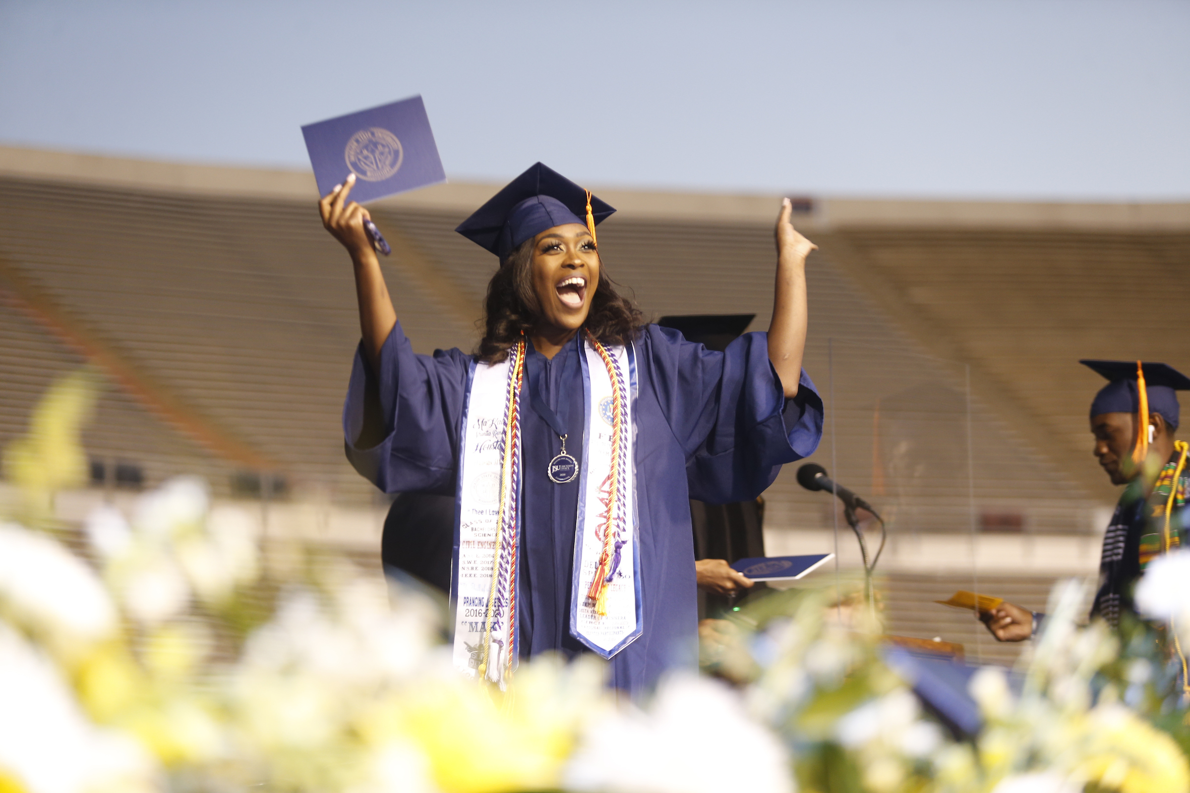 A graduate shouts with joy as she crosses the stage at the Class of 2020 commencement ceremony that took place on May 8. (Photo by William Kelly/JSU)