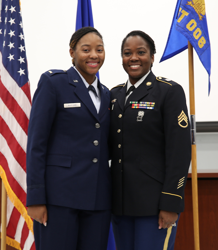 After earning her gold bar, 2nd Lt. Rayford, left, is honored by her aunt. (Photo by Aron Smith/JSU)