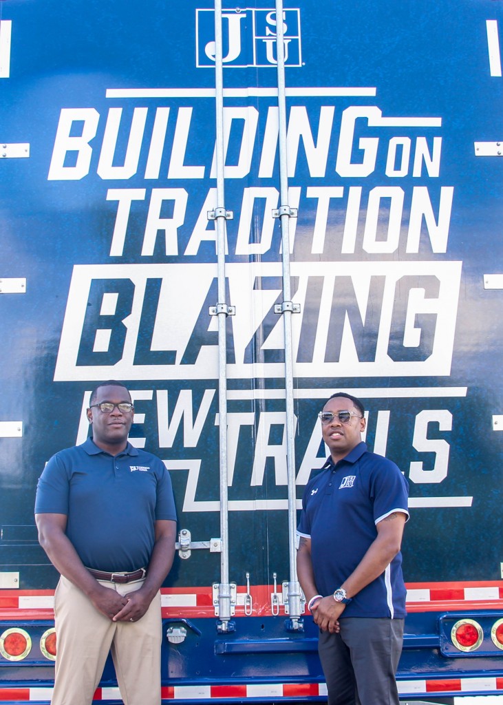 Hudson and Robinson are flanked by the athletics’ motto.
