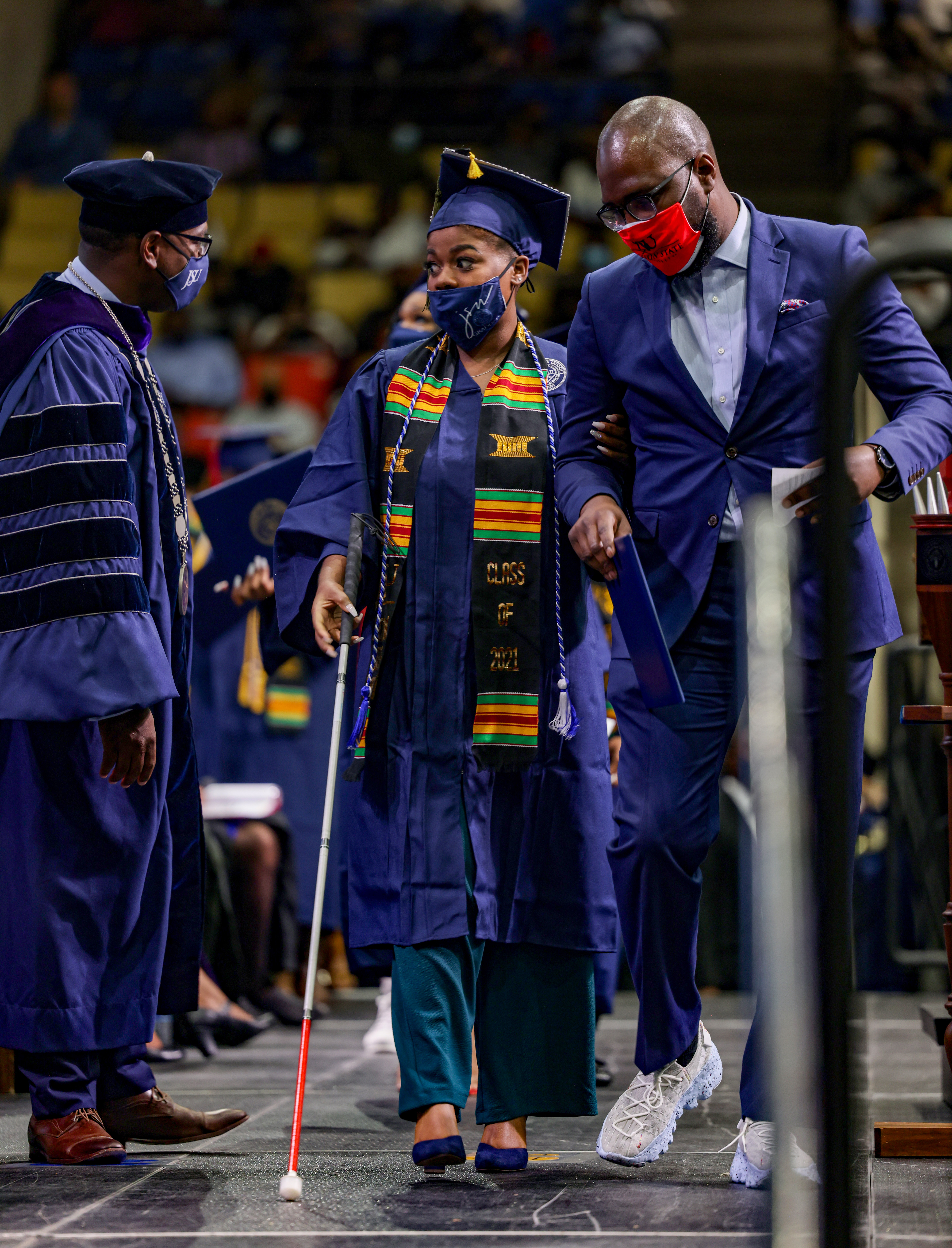 After receiving her degree, Arron Richardson, Ph.D. escorts Maberry off stage. (Photo by: Charles A. Smith/UniversityCommunications)