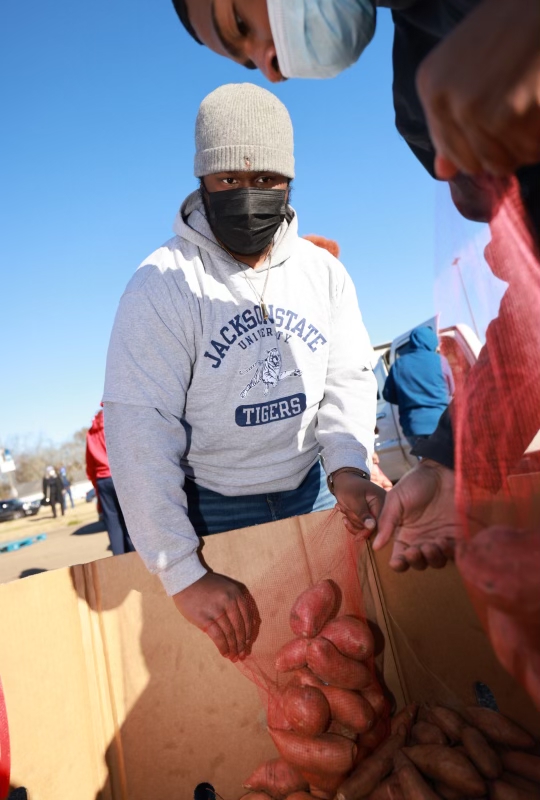 Student volunteers bagged 20,000 pounds of sweet potatoes during the bi-annual Crop Drop on Saturday. (Photo by Charles Smith/University Communications)