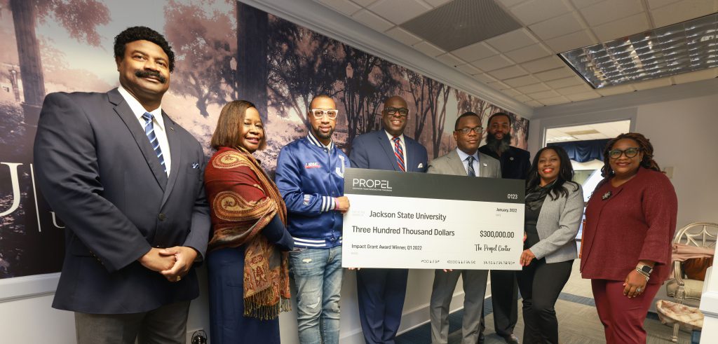 Jackson State University will use a new arts and entertainment grant to create new learning experiences for Department of Music students in the College of Liberal Arts. "We are very appreciative for the support from Propel and Apple. Jackson State University is committed to student success. This collaboration with Thee I Love is invaluable, and allows us to more effectively engage and prepare our students as they endeavor to become transformative leaders of tomorrow," says KB Turner, Ph.D, dean of the College of Liberal Arts, pictured far left.