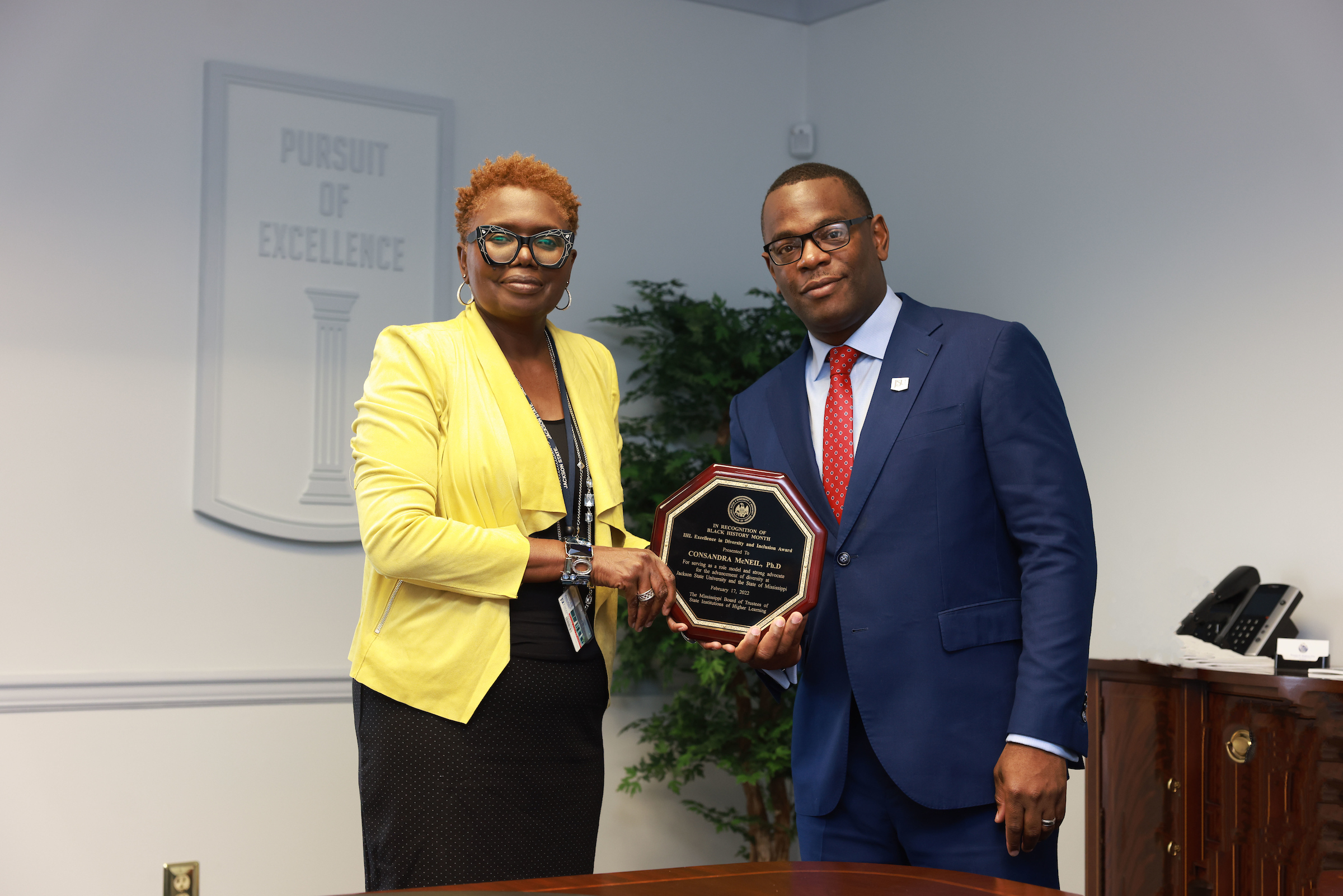 Assistant Provost ConSandra McNeil, Ph.D., is presented with a diversity award by JSU President Thomas K. Hudson, J.D. The Mississippi Board of Trustees of the State Institutions of Higher Learning recognized McNeil on Feb. 17. (Photo by William Kelly/JSU)