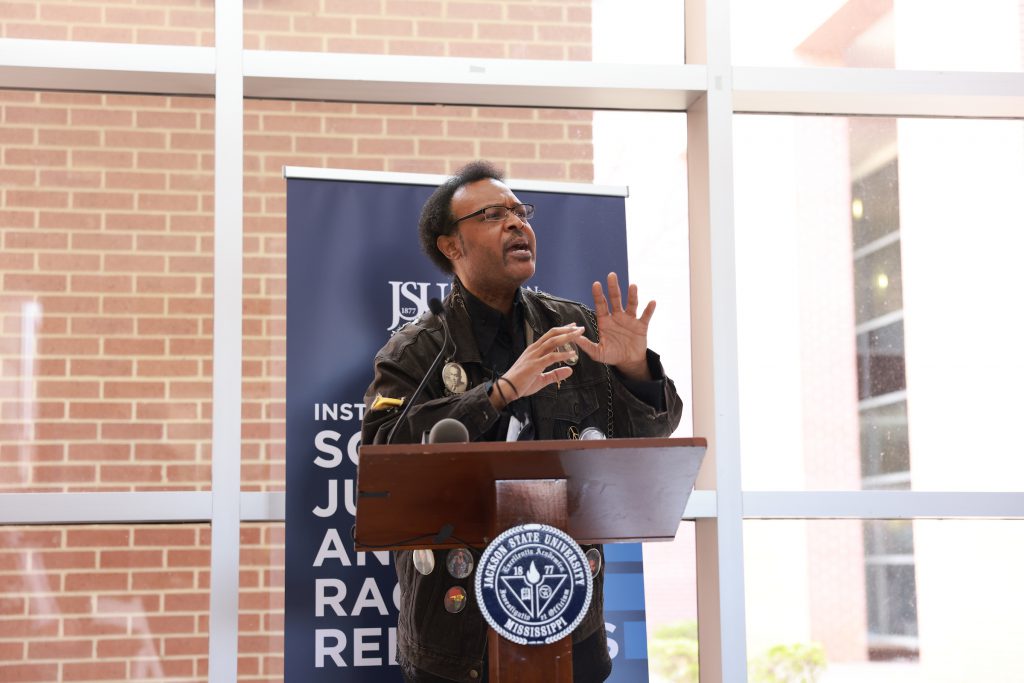 C. Liegh McInnis, retired English professor, delivered a powerful poem about the perils of racism. (Photo by William Kelly/JSU)
