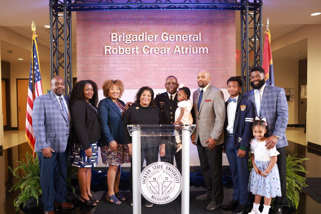 Brigadier General Robert Crear is flanked by his family during the unveiling ceremony of the CSET atrium bearing his name. (Photo by William Kelly/JSU)
