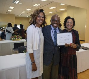Faculty Senate President Dawn McLin, Ph.D. (left), and Secretary Andre L. Hines, Ph.D., (right) present a certificate of appreciation to Associate Professor Okechukwo Anyamele, Ph.D., during the Annual Faculty Senate Lunch at Jackson State University.
