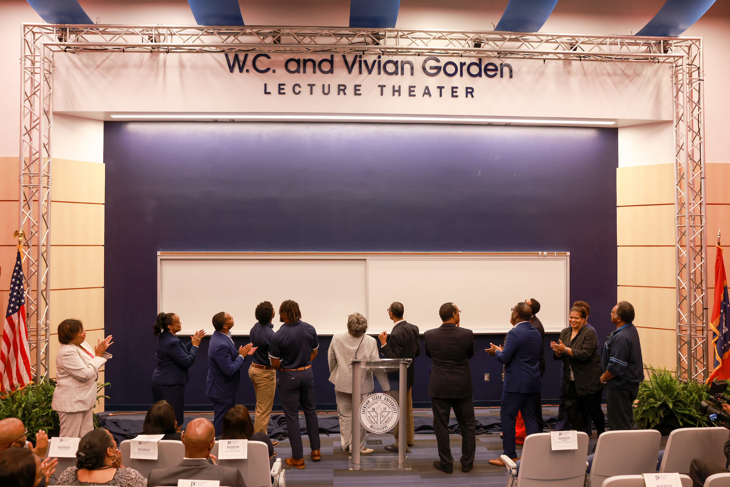 (Photo Credit: Platform observe the unveiling of the newly built lecture theater dedicated to W.C. and Vivian Gorden. Charles A. Smith/University Communications)