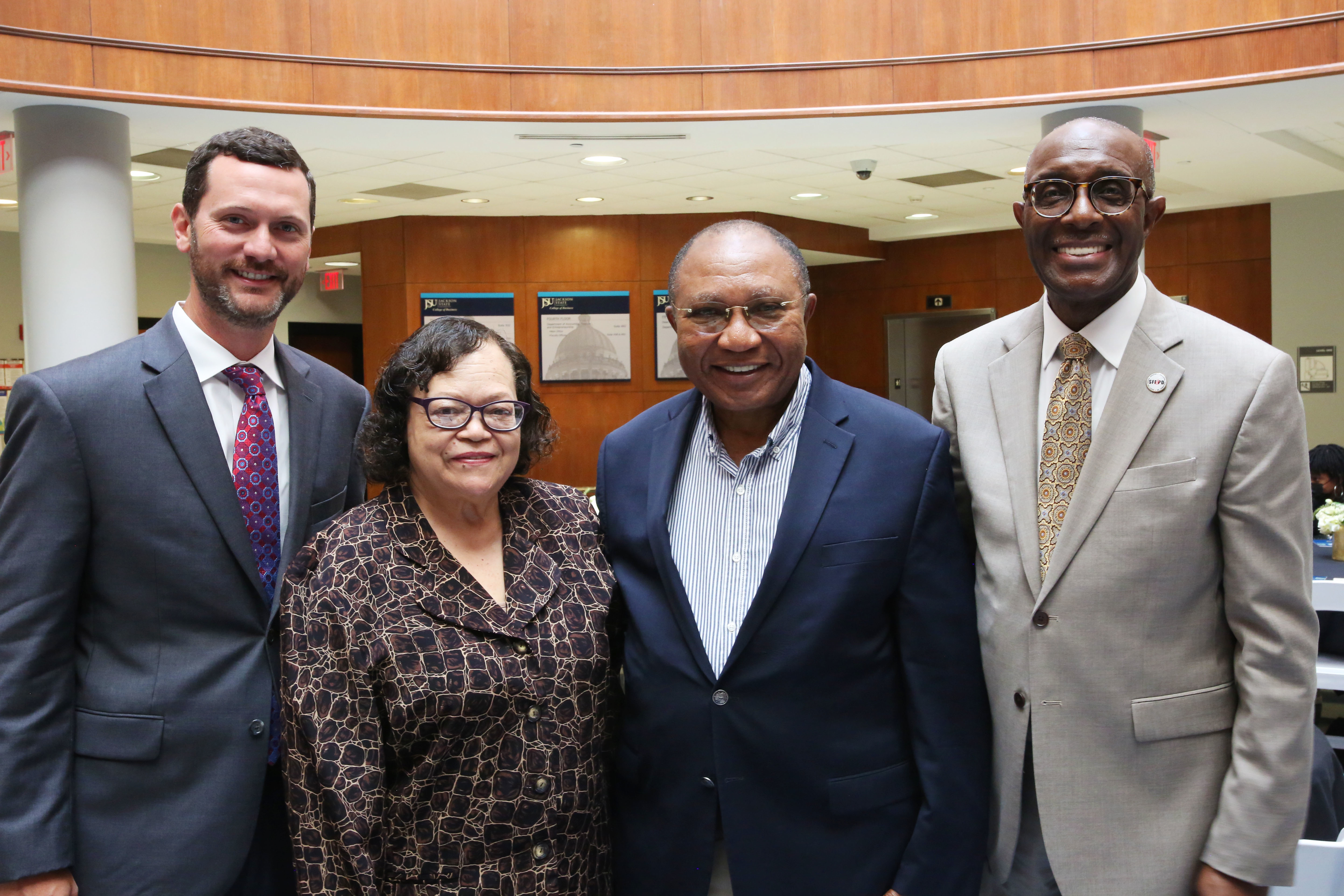 (Left) Wells Fargo District Manager, Mike Ryan, (Center Left) Mary White, Ph.D., (Center Right) College of Business Dean, Fidelis Ikem, Ph.D.,(Right) SFE&PD Founder and President, Theodore R. Daniels